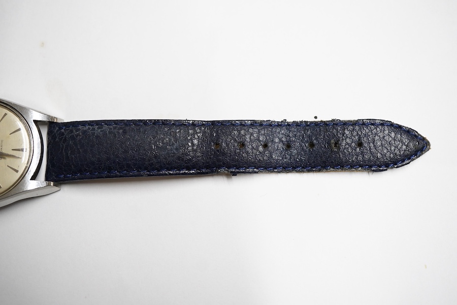 A gentleman's stainless steel Girard Perregaux Gyromatic wrist watch, with baton numerals, case diameter 33mm, on a later associated leather strap, no box or papers.